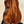 Acoustic guitar with rich brown wood grain in Kanile’a K-2 Deluxe Concert Ukulele