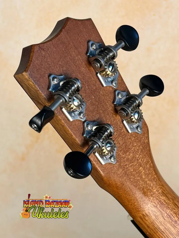 Guitar headstock with black tuning pegs on Kanile’a K-2 Deluxe Concert Ukulele