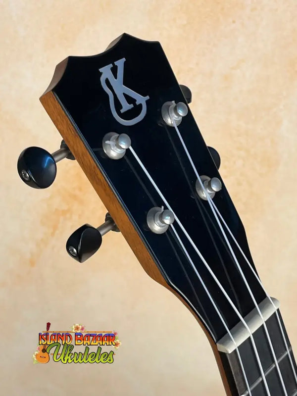 Guitar headstock with silver tuning pegs on Kanile’a K-2 Deluxe Concert Ukulele