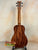 Wooden Kanile’a K-2 Deluxe Concert Ukulele with Hawaiian Koa Body on black stand