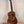 Beautiful Koa wood Kanilea K-2 Premium Tenor Ukulele with dark grain in display stand