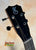 Black ukulele headstock with chrome tuning pegs on Kanile’a K-3 Baritone Curly Koa