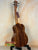 Beautiful Koa wood Kanile’a K-3 Tenor Ukulele displayed on a black stand