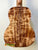 Acoustic guitar back panel of Kanilea K-3T Tenor showcasing deluxe koa with stunning grain