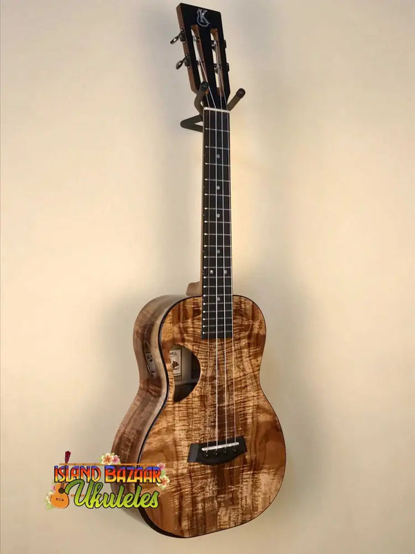 Beautiful Kanilea K-3T Tenor Ukulele Deluxe Koa showcasing unique grain and D-shaped sound hole