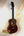 Wooden Kanilea K3-T Tenor Koa Ukulele with dark brown finish and maple rosette