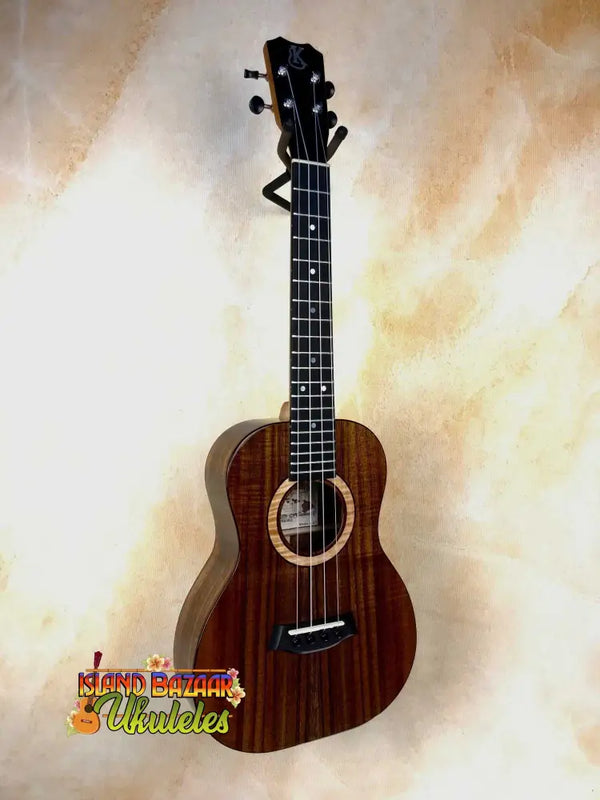 Wooden Kanilea K3-T Tenor Koa Ukulele with dark brown finish and maple rosette