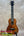 Kanileʻa koa core concert ukulele with rich warm-toned wood finish and intricate grain patterns in deluxe gig bag