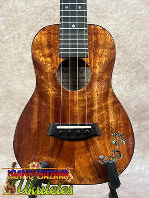 Kanileʻa koa core concert ukulele with warm brown wood finish and inlaid turtle design, perfect for kanileʻa honus tenor fans