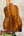 Kanileʻa koa core concert ukulele with deluxe gig bag in glossy amber wood featuring rich grain and elegant curves