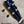 Black kanileʻa honus tenor ukulele headstock with blue white logo gold tuning pegs and black knobs
