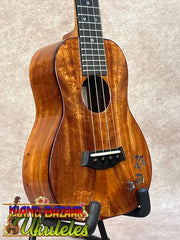Kanileʻa koa core concert ukulele with warm polished wood and floral inlay, ideal for kanileʻa honus tenor players