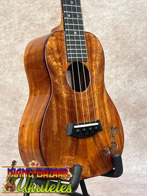 Kanileʻa koa core concert ukulele with warm polished wood and floral inlay, ideal for kanileʻa honus tenor players