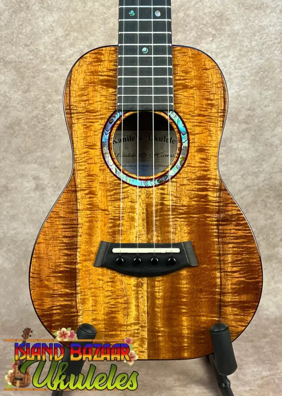 Hawaiian koa Kanileʻa KPA-C Master Concert Ukulele with abalone rosette and black bridge