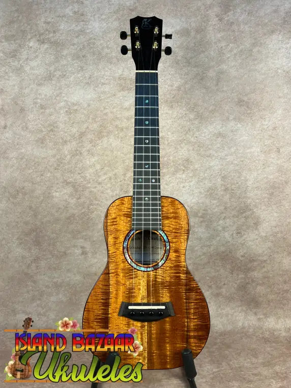 Vibrant flamed koa wood Kanileʻa KPA-C Master concert ukulele with black headstock