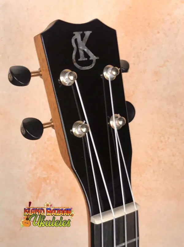 Black Kanilea KPA-C PREM headstock with silver tuning pegs and stylish K logo