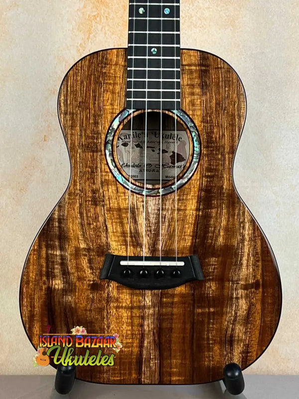 Beautiful Kanilea KPA Curly Koa Tenor Ukulele showcasing unique wood grain and rosette