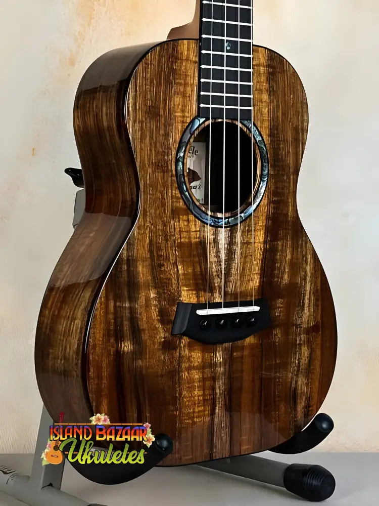 Beautiful Kanilea KPA Curly Koa Tenor Ukulele with ornate rosette detailing