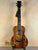 Kanilea KPA Curly Koa Tenor Ukulele showcasing elegant dark grain patterns