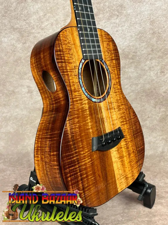 Vibrant orange-brown Kanile’a KPA Pro Tenor Koa Ukulele with abalone soundhole inlay