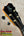 Headstock of Kanile’a KPA Pro Tenor Koa Ukulele with black tuning pegs and mother-of-pearl KS inlay