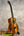 Glossy dark brown KPA Pro Tenor Koa Ukulele with black fretboard and tuning pegs
