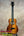 Glossy dark orange-brown Kanile’a KPA Pro Tenor Koa Ukulele with black fretboard and light rosette