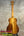 Light brown Kanile’a KPA Pro Tenor Koa Ukulele with rich wood grain and vertical stripe