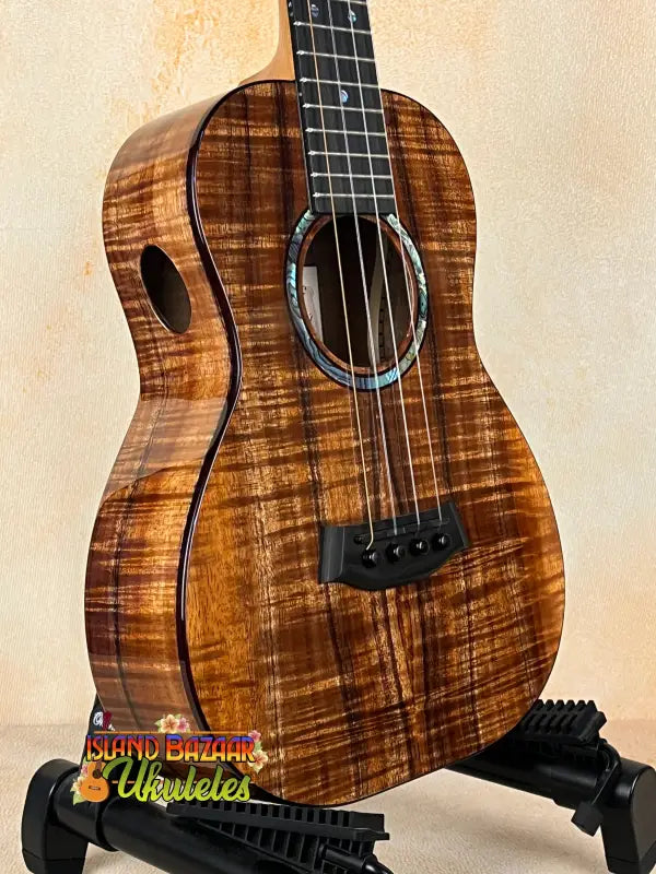 Brown wooden Kanile’a KPA Pro Tenor Ukulele with sound port in deluxe gig bag