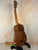 Wooden Kanile’a KPA Pro Tenor Koa Ukulele on a stand with a Deluxe Gig Bag