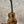 A kanilea kpa pro tenor ukulele with a warm golden-brown solid mango wood body and black fretboard in deluxe gig bag