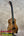 A kanilea kpa pro tenor ukulele with a warm golden-brown solid mango wood body and black fretboard in deluxe gig bag
