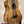 Kanileʻa kpa pro tenor ukulele with rich golden-brown solid mango body and iridescent abalone soundhole inlay