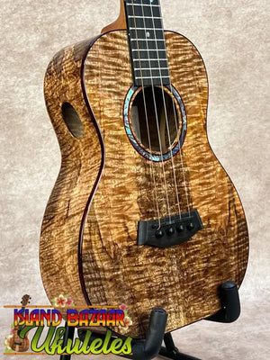 Kanileʻa kpa pro tenor ukulele with rich golden-brown solid mango body and iridescent abalone soundhole inlay