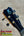 Black tenor ukulele headstock with iridescent inlay and gold tuning pegs from kanileʻa kpa pro premium solid mango