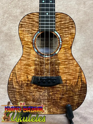 Kanile’a kpa pro tenor ukulele with premium solid hawaiian koa golden-brown wood grain and black fretboard