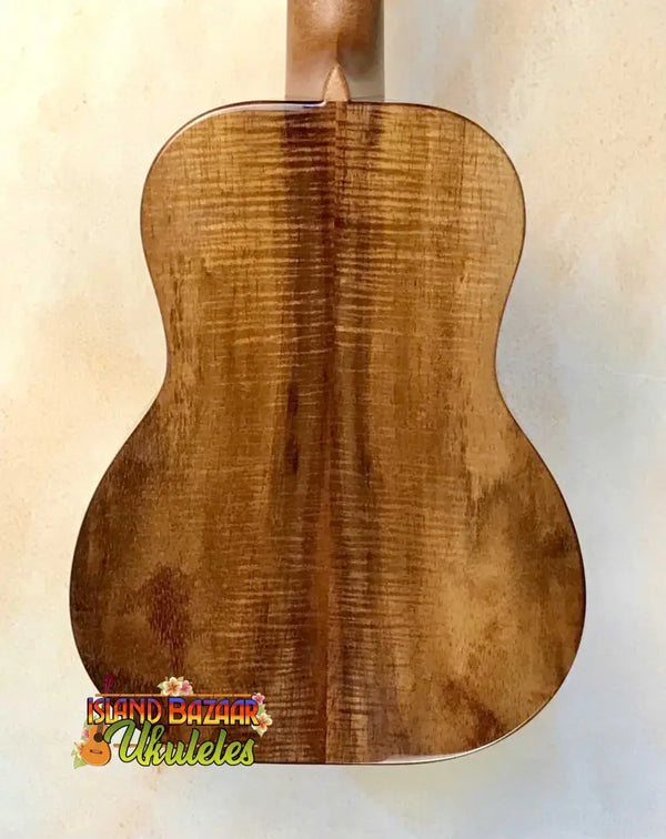 Wooden back panel of Kanilea KPA-T PREM tenor ukulele showcasing curly koa grain patterns