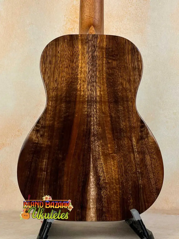 Acoustic guitar with rich brown Koa wood back on Kanilea KPA-T Tenor Ukulele Hawaiian Koa