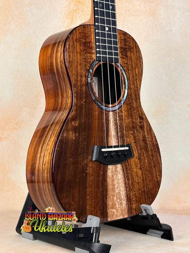 Kanilea KPA-T Tenor Ukulele in Hawaiian Koa featuring dark grain and ornate rosette