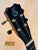 Black Kanilea KPA-T Tenor Ukulele headstock with blue inlay and gold tuning pegs