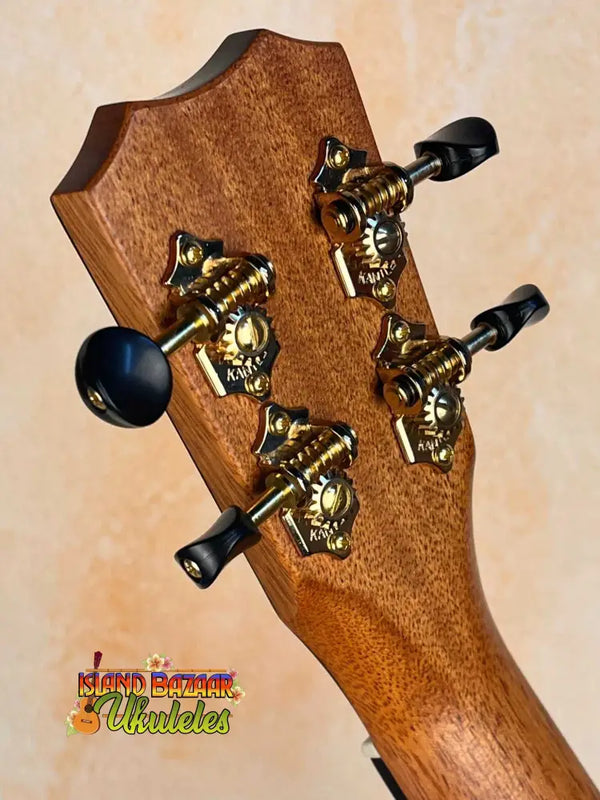 Guitar headstock with ornate gold tuning pegs on Kanilea KPA-T Tenor Hawaiian Koa Ukulele