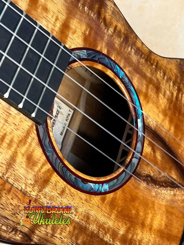 Acoustic guitar featuring an abalone rosette and figured maple, ideal for Kanilea KPA-T Tenor Ukulele