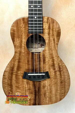 Beautiful Koa wood Kanilea KSR Premium Tenor Ukulele with wavy grain patterns