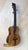 Beautiful Koa wood Kanilea KSR Premium Tenor Ukulele with dark fretboard and strings