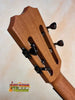 Wooden guitar headstock with black tuning pegs on Kanile’a KTR-T Master-Grade Koa Tenor Ukulele