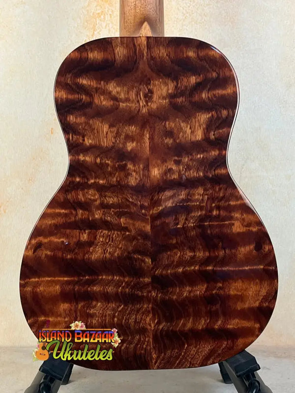 Acoustic guitar featuring rich tiger-striped wood grain on Kanile’a KPA-T Master Koa Tenor Ukulele