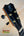 Black guitar headstock with gold tuning pegs on Kanile’a KPA-T Master Koa Tenor Ukulele