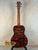 Wooden acoustic Kanile’a KPA-T Master Koa Tenor Ukulele with rich tiger-stripe wood grain