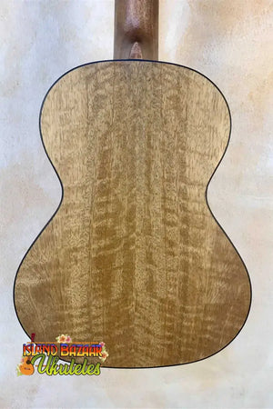 Acoustic guitar back panel of figured maple wood on Kanile’a MT-4 Mahogany Tenor Ukulele