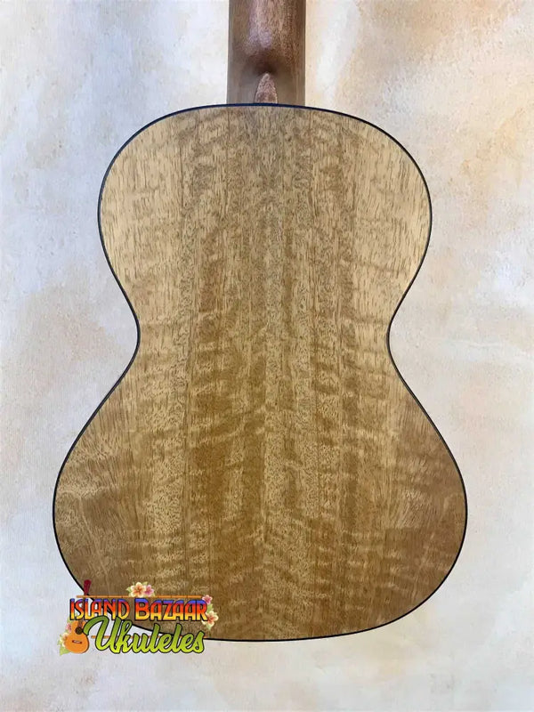 Acoustic guitar back panel of figured maple wood on Kanile’a MT-4 Mahogany Tenor Ukulele